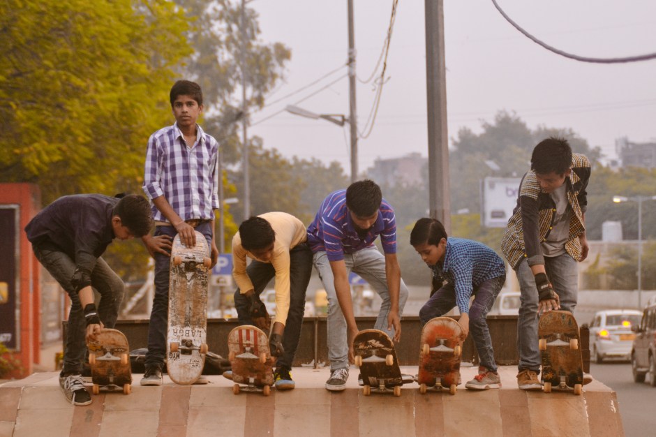 ​The "Sunday Morning Kids," more commonly known as slums kids, go out on a skateboarding field trip. They must head out to the streets as early as 6am so as to avoid street traffic or any trouble with the police. Free Motion Skatepark in Delhi provides the boards, shoes, elbow guards, and accompaniment on these early-morning trips taken on the first Sunday of each month, free of charge. New Delhi, India. 