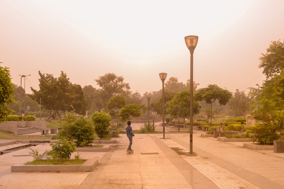 ​A young skateboarder enjoys the tranquility of early mornings in New Delhi, India.