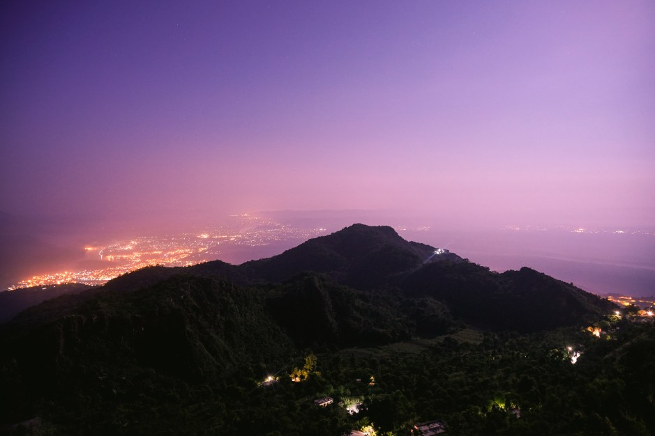 At 3:45am, we hired a jeep to take us up to the Kaunja Puri Temple in the foothills of the Himalayas. We took the car as far up the mountain road as possible, before hitting a staircase that would lead us the rest of the way up to the temple. This is the view of the Ganges river valley, before sunrise. Rishikesh, India. 