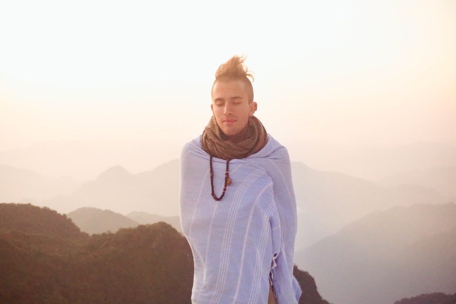 ​A fellow student enjoying the sunrise at the Kaunja Puri Temple in the Himalayan Foothills. Rishikesh, India. 
