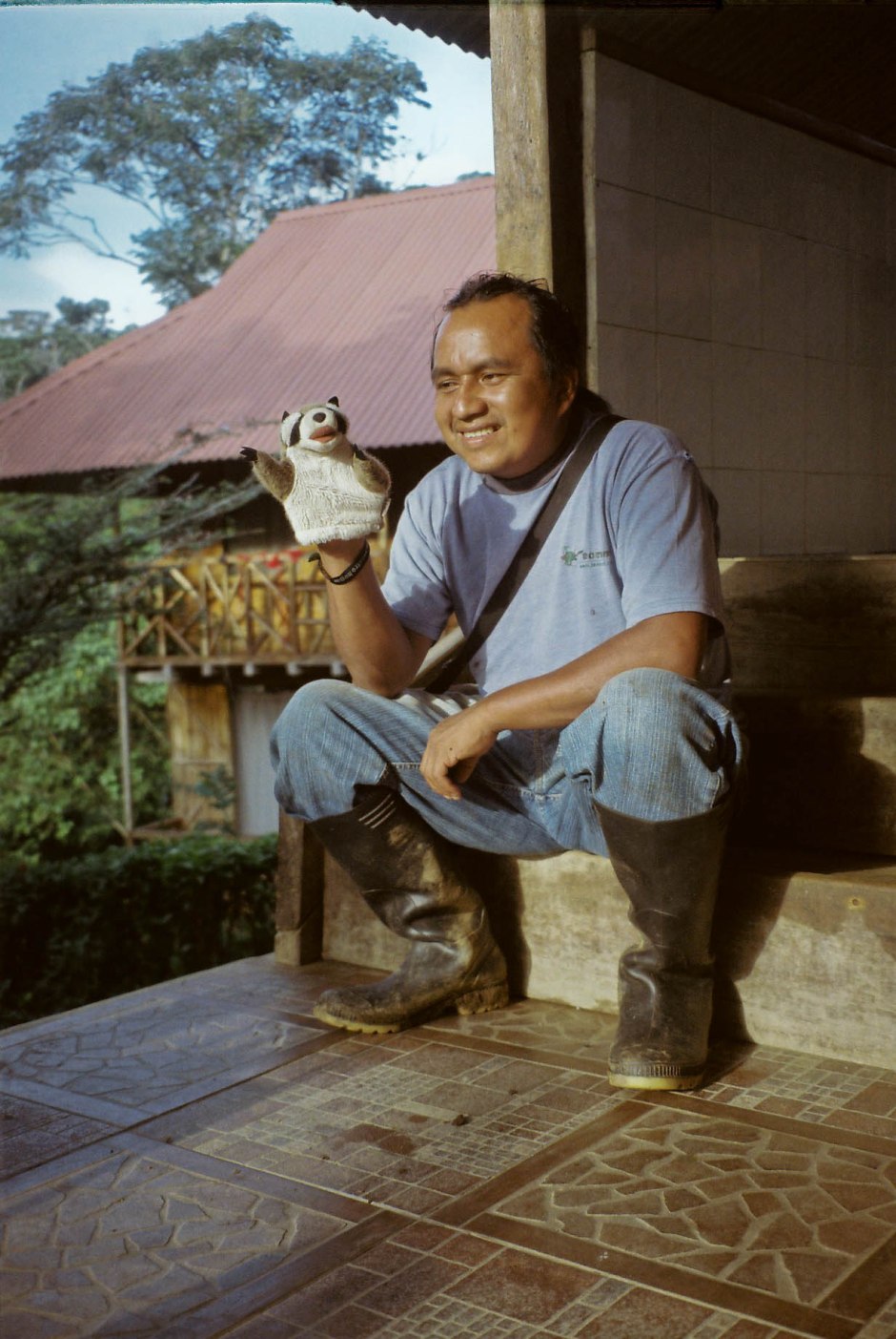 Our Quichua guide Teo holds my mapache puppet during a break between teaching us how to identify every Amazon insect and animal, build transects and quadrants, swing on vines, and eat bugs. Sinchi Sacha, Ecuador. 