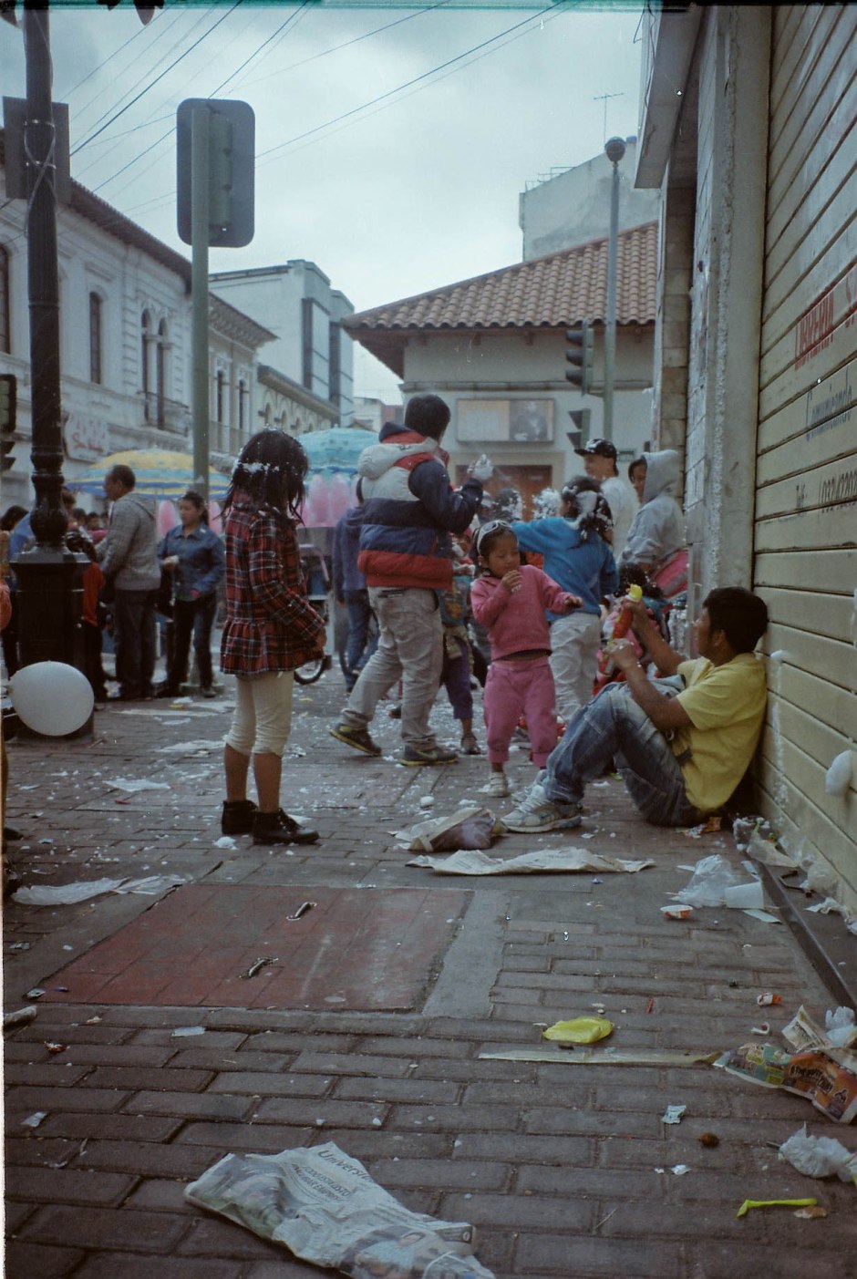 A few of the 20,000 people that travel to celebrate carnaval in the city of Ambato spray each other with espuma. It is impossible to walk outside without being attacked by this foamy shaving cream substance and it is unadvisable to travel these areas if not ready to partake in days of parades, outdoor concerts, and the endless running/chasing of these espuma wars. Ambato, Ecuador. 